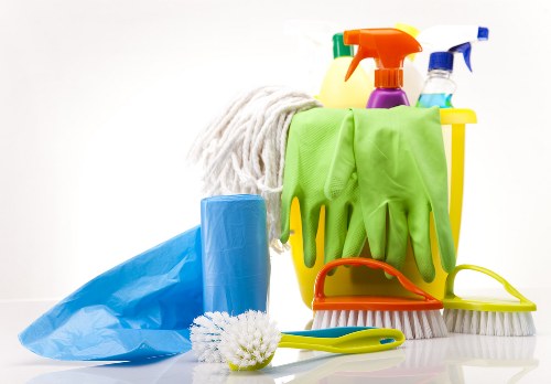 Cleaner in W9 deep cleaning a modern kitchen