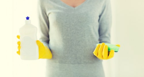Deep cleaning of a living room sofa during upholstery cleaning in W9