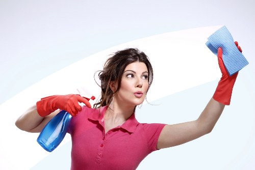 Staff member wearing protective gear during carpet cleaning